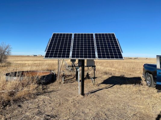 solar well pump system in the middle of a field
