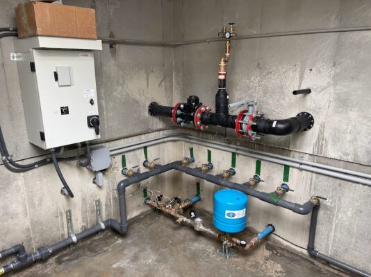 well pump system installed in the basement of a building